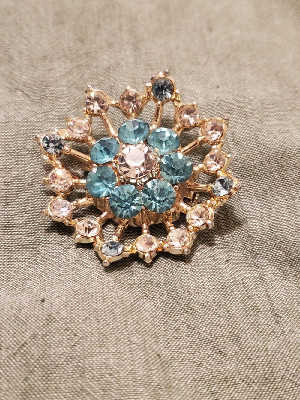 Vintage starburst snowflake brooch